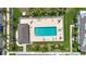 This aerial view showcases a community pool with inviting residences and landscaping at 732 Kensington Lake Cir, Brandon, FL 33511