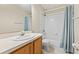 Bathroom with a shower, standard toilet, and wooden vanity with white countertop at 732 Kensington Lake Cir, Brandon, FL 33511