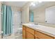 Bathroom with a shower, standard toilet, and wooden vanity with white countertop at 732 Kensington Lake Cir, Brandon, FL 33511
