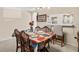 Inviting dining area featuring tile flooring, chandelier, and elegant furniture at 732 Kensington Lake Cir, Brandon, FL 33511