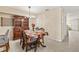Charming dining room showcases a decorative table setting, hutch and neutral paint at 732 Kensington Lake Cir, Brandon, FL 33511