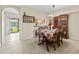 Cozy dining area with tiled floor, chandelier, and stylish china cabinet at 732 Kensington Lake Cir, Brandon, FL 33511
