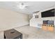 Large living room boasts tile flooring, ceiling fan and neutral paint, awaiting your personal touch at 732 Kensington Lake Cir, Brandon, FL 33511