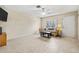 Bright living room features neutral walls, tiled floors, and a cozy seating area at 732 Kensington Lake Cir, Brandon, FL 33511