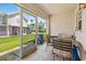 This screened patio is equipped with tile flooring, a table, and chairs, offering a relaxing outdoor space at 732 Kensington Lake Cir, Brandon, FL 33511