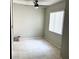 Bedroom with tile flooring, ceiling fan, and window providing natural light at 7506 Presley Pl # 107, Tampa, FL 33617