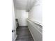 Walk-in closet with laminate flooring, white walls, and wire shelving at 7506 Presley Pl # 107, Tampa, FL 33617