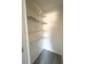 Closet featuring laminate flooring and wire shelving at 7506 Presley Pl # 107, Tampa, FL 33617