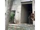 Exterior entrance to the building with stairs leading to the upper levels with the building address posted at 7506 Presley Pl # 107, Tampa, FL 33617