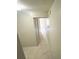 Neutral hallway with access to multiple rooms featuring ceramic tile flooring at 7506 Presley Pl # 107, Tampa, FL 33617