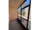 Enclosed patio showcasing outdoor living with screening offering views of the community and landscaping at 7506 Presley Pl # 107, Tampa, FL 33617