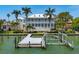 Spacious waterfront property featuring a private boat dock and lift at 755 Bay Esplanade, Clearwater Beach, FL 33767