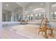 Luxurious bathtub featuring gold fixtures, marble countertop, and ornate mirrors at 755 Bay Esplanade, Clearwater Beach, FL 33767