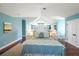 Bedroom with vaulted ceilings, blue walls, and a decorative bed with matching bedside tables at 755 Bay Esplanade, Clearwater Beach, FL 33767