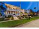 Elegant multi-story home with classic white columns, manicured landscaping, and inviting curb appeal at 755 Bay Esplanade, Clearwater Beach, FL 33767