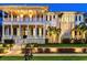 Elegant multi-story home with classic white columns, manicured landscaping, and inviting curb appeal at 755 Bay Esplanade, Clearwater Beach, FL 33767