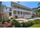 Elegant home with a sparkling pool, stone patio, and pristine landscaping for upscale outdoor living and sophisticated entertaining at 755 Bay Esplanade, Clearwater Beach, FL 33767