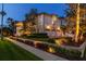 Beautiful two-story home with lush landscaping, an attached three-car garage, and brick-paved driveway at 755 Bay Esplanade, Clearwater Beach, FL 33767