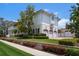 Beautifully landscaped property with a spacious three-car garage and well-maintained lawn at 755 Bay Esplanade, Clearwater Beach, FL 33767