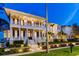 Elegant multi-story home with classic white columns, manicured landscaping, and inviting curb appeal at 755 Bay Esplanade, Clearwater Beach, FL 33767