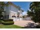Spacious three-car garage and additional one-car garage with brick driveway at 755 Bay Esplanade, Clearwater Beach, FL 33767