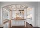 Gourmet kitchen featuring custom cabinets, a large island, and high-end appliances at 755 Bay Esplanade, Clearwater Beach, FL 33767