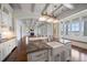 Open concept kitchen with island seating, water views, and modern lighting at 755 Bay Esplanade, Clearwater Beach, FL 33767