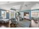 Inviting living room with water view, built-in wet bar, and comfortable seating at 755 Bay Esplanade, Clearwater Beach, FL 33767