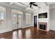 Bright living room boasting a coffered ceiling, fireplace, and French doors to a waterfront balcony at 755 Bay Esplanade, Clearwater Beach, FL 33767