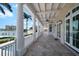 Covered patio with columns overlooking the bay at 755 Bay Esplanade, Clearwater Beach, FL 33767