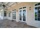 Covered patio with tiled floor and water view at 755 Bay Esplanade, Clearwater Beach, FL 33767