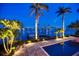 Backyard pool and private dock with stunning waterfront views and city skyline in the background at 755 Bay Esplanade, Clearwater Beach, FL 33767