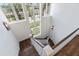 Bright staircase with large windows offering abundant natural light and views of the surrounding landscape at 755 Bay Esplanade, Clearwater Beach, FL 33767