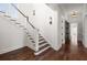 Elegant staircase with white railings and hardwood steps, leading to upper floors at 755 Bay Esplanade, Clearwater Beach, FL 33767
