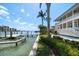 This waterfront home features a private dock, pool, and lush landscaping, offering a serene coastal lifestyle at 755 Bay Esplanade, Clearwater Beach, FL 33767