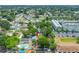 Aerial view of a neighborhood with mature trees, showcasing the property's location and proximity to amenities and green spaces at 8444 8Th N Way, St Petersburg, FL 33702