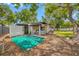 Spacious backyard with a detached accessory structure and ample greenery at 8444 8Th N Way, St Petersburg, FL 33702