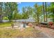 Expansive backyard featuring a stone patio with a fire pit and outdoor seating, perfect for entertaining guests at 8444 8Th N Way, St Petersburg, FL 33702