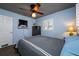 Comfortable bedroom features a ceiling fan, window with shutters, and wood floors at 8444 8Th N Way, St Petersburg, FL 33702