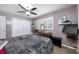 Bedroom with ceiling fan, wood floors, white closet doors and bureau at 8444 8Th N Way, St Petersburg, FL 33702