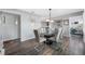 Open dining area featuring a modern glass table, gray chairs, and seamlessly connects to other living spaces in the home at 8444 8Th N Way, St Petersburg, FL 33702