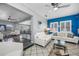 Spacious living room featuring bright windows, tile flooring, modern furniture, and an open layout at 8444 8Th N Way, St Petersburg, FL 33702
