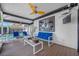 Inviting covered patio with modern furniture, ceiling fan and outdoor television at 8444 8Th N Way, St Petersburg, FL 33702