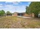 Large backyard features a screened-in porch and a play set at 8531 Woodcrest Dr, Port Richey, FL 34668