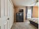 The spacious bedroom offers large closets, neutral carpet, and a sunlit window at 8531 Woodcrest Dr, Port Richey, FL 34668