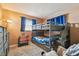 room with gray bunk beds and blue decor at 8531 Woodcrest Dr, Port Richey, FL 34668