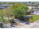 Attractive community sign set amidst lush greenery and landscaping, creating a welcoming entrance at 8531 Woodcrest Dr, Port Richey, FL 34668