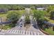 Inviting community entrance with landscaped median, signage, and well-maintained roadway at 8531 Woodcrest Dr, Port Richey, FL 34668