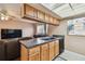 Efficient kitchen layout featuring lots of cabinet storage, ideal for easy meal preparation and serving at 8531 Woodcrest Dr, Port Richey, FL 34668