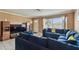 Living room with a large window providing plenty of natural light at 8531 Woodcrest Dr, Port Richey, FL 34668